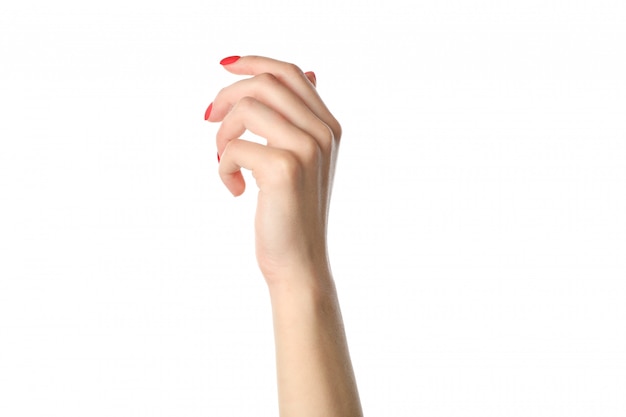 Mani della donna, manicure rosso alla moda isolato su fondo bianco, primo piano. Concetto di assistenza sanitaria