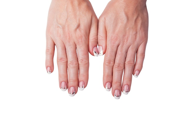 Mani femminili con una manicure isolata