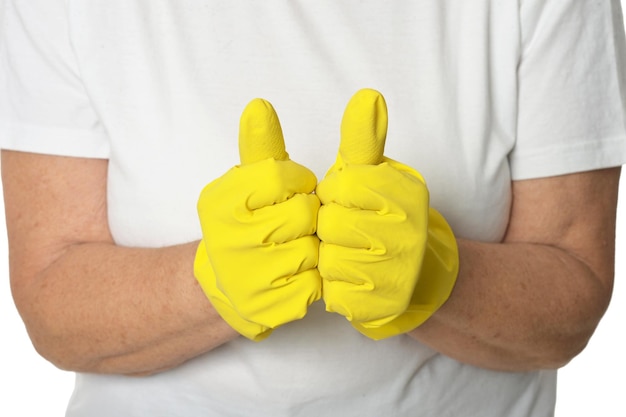 Mani in guanti gialli che mostrano i pollici in su