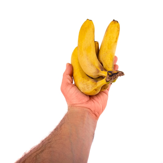 Mano che tiene Banana isolata su sfondo bianco