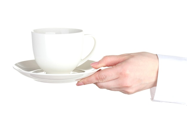 Mano della donna con la tazza di caffè isolata su bianco