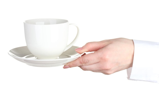 Mano della donna con la tazza di caffè isolata su bianco