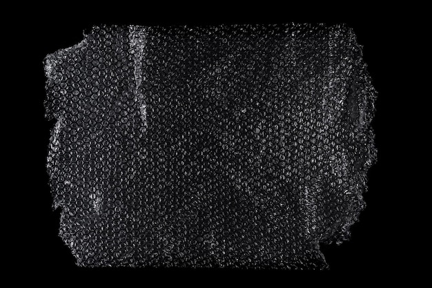 Materiale di sovrapposizione per l'imballaggio a bolle di plastica a consistenza su sfondo nero