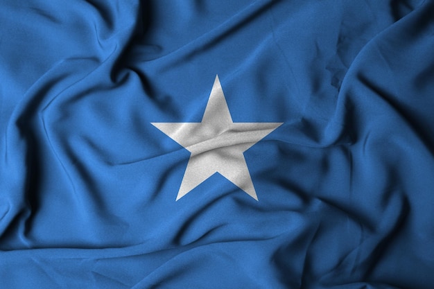 Messa a fuoco selettiva della bandiera della Somalia, con tessuto ondulato. illustrazione 3d