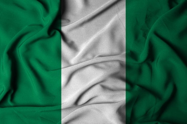 Messa a fuoco selettiva della bandiera nigeriana, con tessuto ondulato. illustrazione 3d