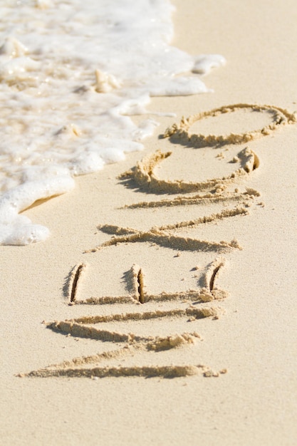Messico scritto sulla spiaggia con l'onda.