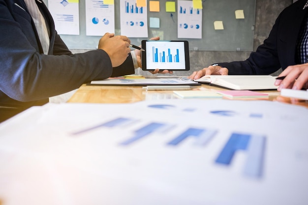 Midsection of business colleagues working at office