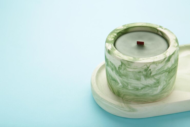Mint plaster trays on blue background Stands for candles or jewelry Top view