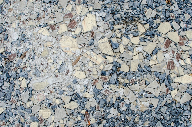 Miscela di ghiaia con sfondo texture di piastrelle crack