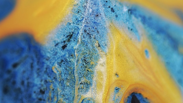 Miscela di pigmenti di sfondo astratto giallo-blu