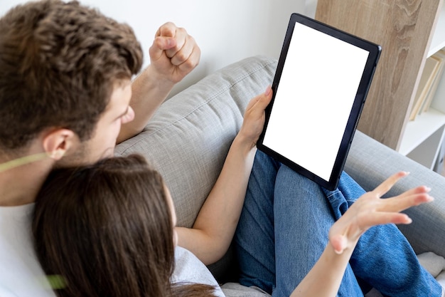 Mobile mockup happy couple winner excitement cheerful unrecognizable man and woman looking tablet