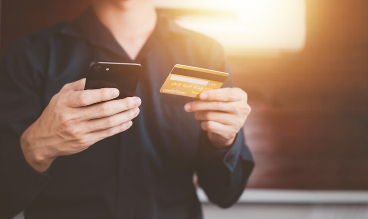 Mobile payment with wallet app via smartphone and credit card technology Businessman shopping online shopping and paying Futuristic Digital money transfer ecommerce banking concept