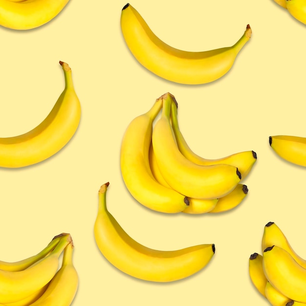 Modello di banana senza soluzione di continuità su uno sfondo giallo banane naturali