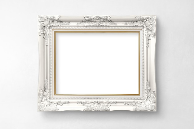 Modello di cornice d'immagine vintage su una parete bianca