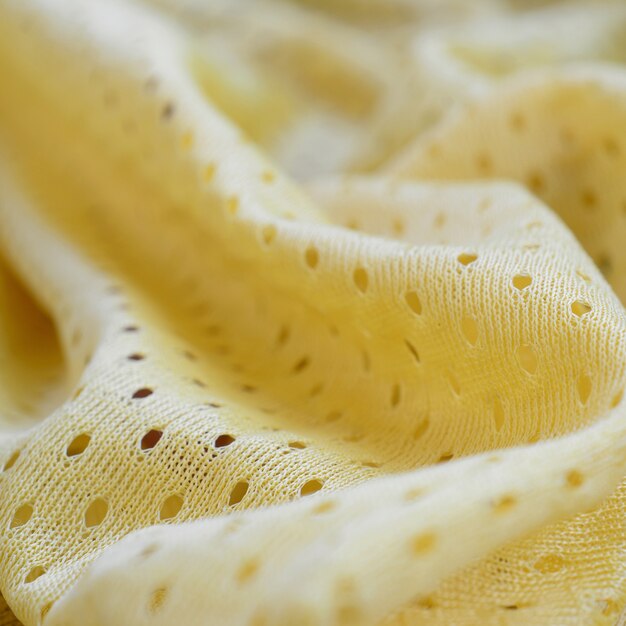 Modello giallo del fondo del tessuto del tessuto di usura di sport della maglia