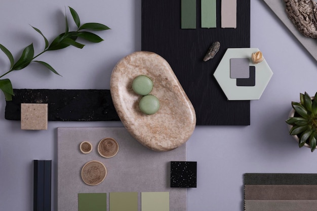 Moodboard creativo per architetto e interior designer Composizione piatta nella tavolozza dei colori grigio e verde con pannelli e piastrelle per campioni di tessuto e vernice Vista dall'alto Spazio di copia Modello