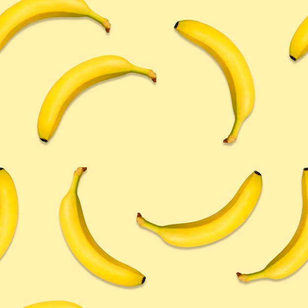Motivo a spirale banana senza cuciture su sfondo giallo banane naturali