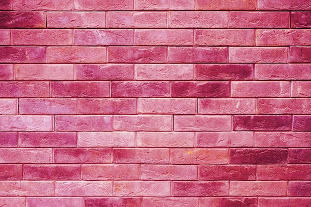 Motivo della superficie decorativa della parete in pietra ardesia rosa come sfondo tonico nel colore di tendenza viva magenta dell'anno 2023