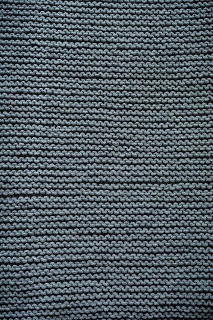 Motivo di sfondo texture lana lavorata a maglia grigia