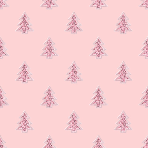 Motivo natalizio creativo con giocattolo rosa Albero di Natale con paillettes lucide Albero di Capodanno su rosa