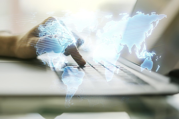 Multi exposure of abstract graphic world map and hands typing on computer keyboard on background big data and networking concept