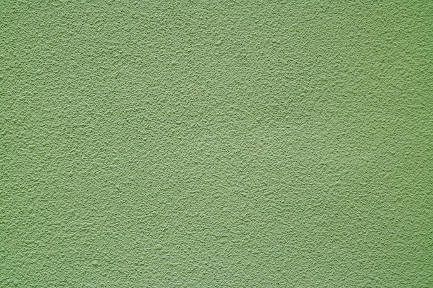 Muro di cemento grezzo colorato verde oliva chiaro