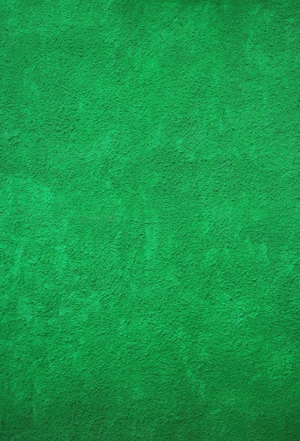 Muro di cemento ruvido dipinto verde vivo per fondo