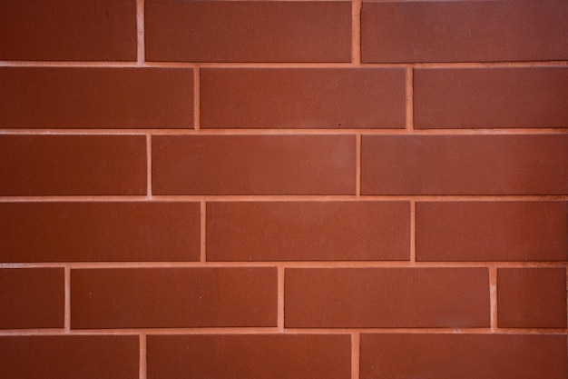 Muro di mattoni marrone con sfondo anche in muratura