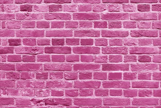 Muro di mattoni rosa. Loft interior design. Sfondo architettonico.