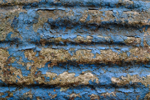 Muro di pietra con vecchia vernice blu. Foto di alta qualità