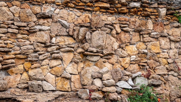 muro di pietra naturale per lo sfondo