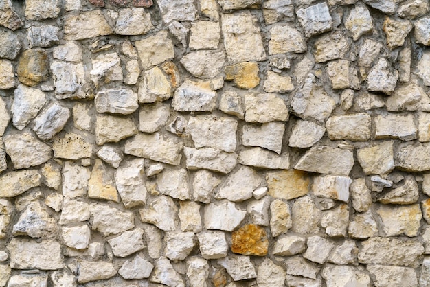 Muro di pietre grigie Sfondo di edificio in pietra