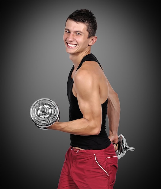 Muscolare, uomo, sollevamento, dumbbells