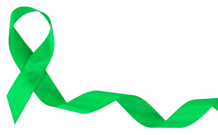 Foto nastro verde. scoliosi, salute mentale e altro, simbolo di consapevolezza isolato su bianco