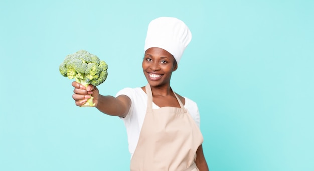 nero, africano, americano adulto, chef, donna, presa a terra, uno, broccoli