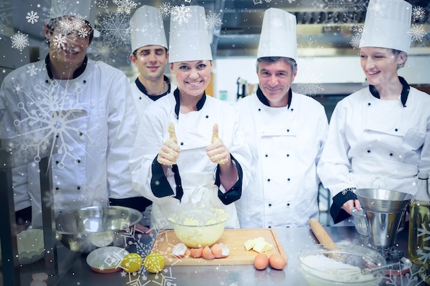 Neve contro la lezione di cucina con l'insegnante di pasticceria che alza il pollice