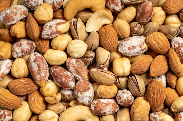 noci miste noci miste speciali in una ciotola di legno noci pistacchi arachidi anacardi mandorle superfood noci concetto alimentare spuntini sani vista superiore