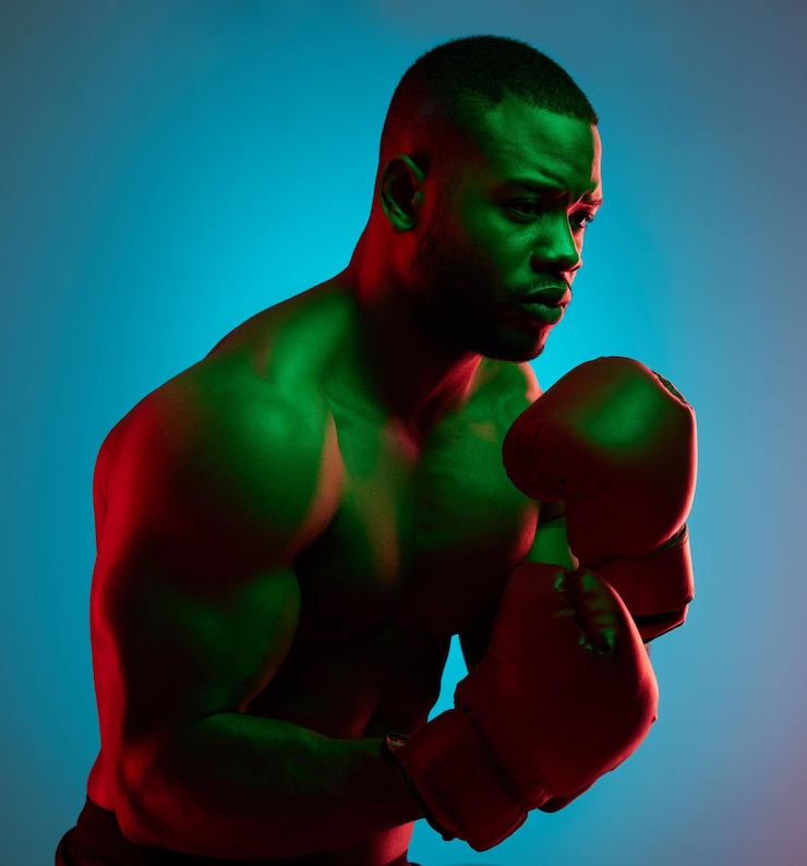 Foto non andrò giù senza combattere ripresa in studio di un giovane sportivo che indossa guanti da boxe