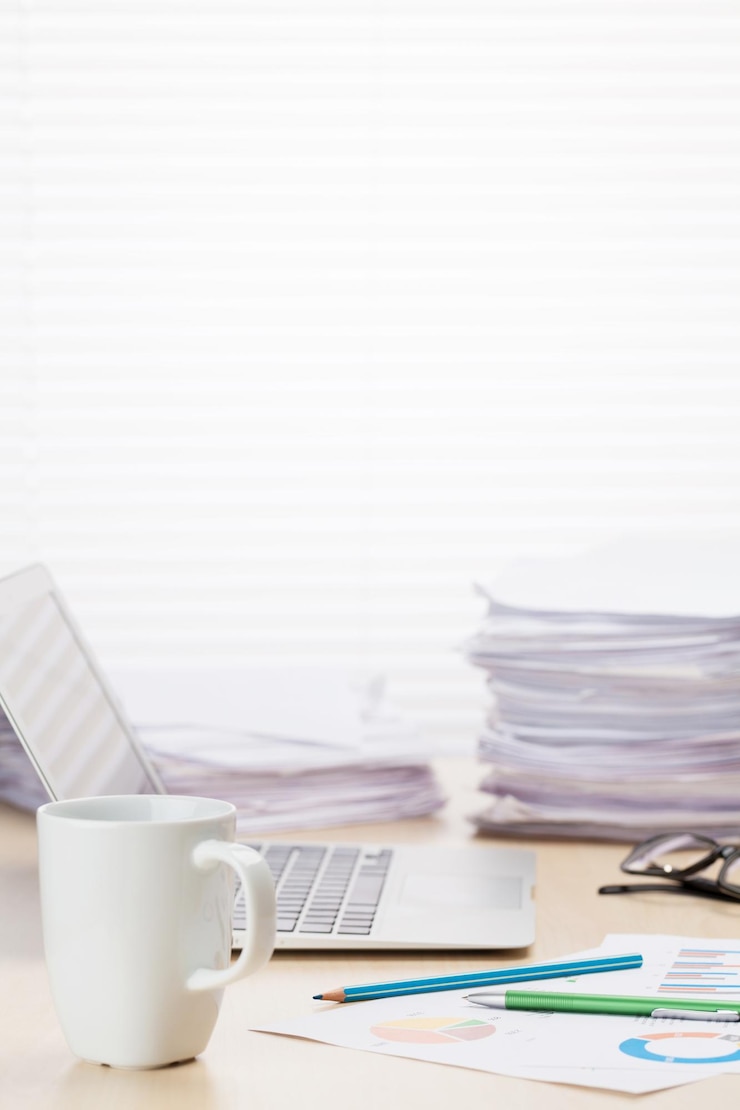 Photo office workplace with coffee cup laptop and supplies