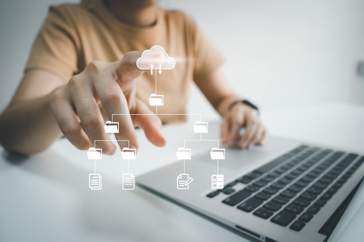 Officer using laptop manage files Document Management System DMS Online document database management automated processes to manage system ERP enterprise efficient business technology