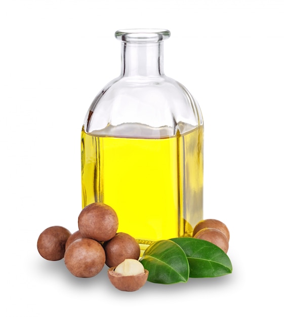 Olio di macadamia in bottiglia e noci