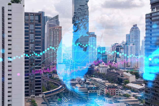 Ologramma grafico del mercato azionario e Forex su vista panoramica sulla città di Bangkok, il centro finanziario in Asia Il concetto di commercio internazionale Doppia esposizione