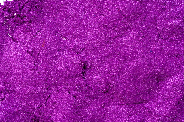 Ombretti fracassati di colore viola brillante, compongono il concetto