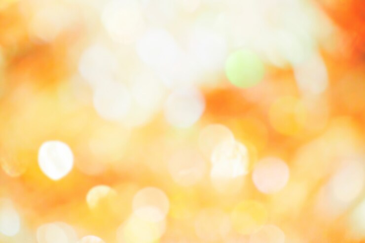 Orange, yellow and white bokeh light. Abstract or blurred of light glitter. Glow texture b