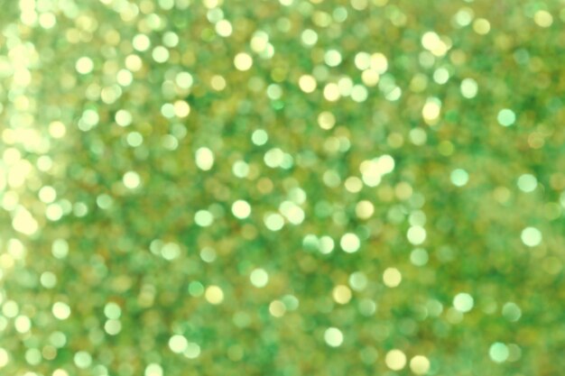 Oro astratto di natale e priorità bassa verde del bokeh.