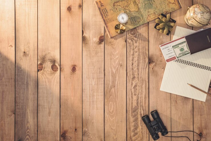 Overhead view of Travelers accessories Essential vacation items and Different objects on wooden