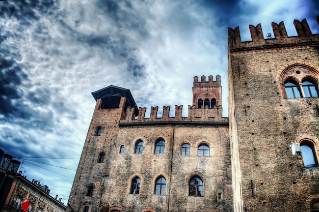 Palazzo dei Notai a Bologna sotto un cielo drammatico Italia