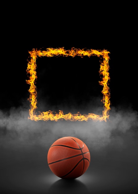 Palla da basket e quadrato di fuoco sullo sfondo di fumo nero