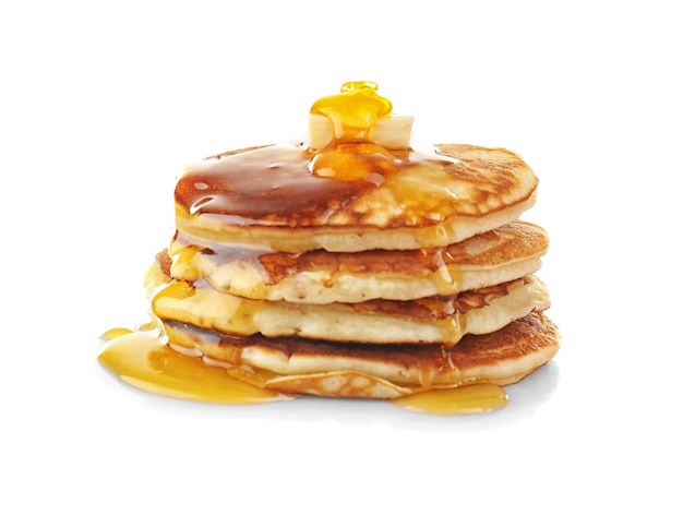 Pancake gustosi con miele e burro isolati su bianco