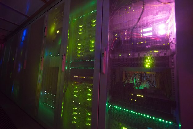 panel modern communication equipment with light from the display at data center in the server room